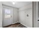 Compact laundry area featuring a door to the outside, shelving, and hookups at 7289 Nc 561, Louisburg, NC 27549