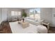 Comfortable living room with a large sofa, neutral colors, and lots of natural light at 7289 Nc 561, Louisburg, NC 27549