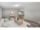A staged living room showing bright, naturally lit living space at 7289 Nc 561, Louisburg, NC 27549