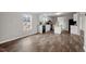 Open-concept living room and kitchen with hardwood floors and lots of light at 7289 Nc 561, Louisburg, NC 27549