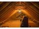 Exposed wooden beams create a unique design in this spacious unfinished attic at 7371 Leasburg Rd, Roxboro, NC 27574