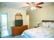 Bedroom with ceiling fan and television on dresser at 7371 Leasburg Rd, Roxboro, NC 27574