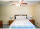 Bedroom with blue patterned bedding and matching lamps at 7371 Leasburg Rd, Roxboro, NC 27574