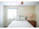 Cozy bedroom featuring a comfortable bed, a window for natural light, and a side table with lamp at 7371 Leasburg Rd, Roxboro, NC 27574