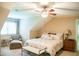 This bedroom has an armchair, a ceiling fan, and a bench at the foot of the bed at 7371 Leasburg Rd, Roxboro, NC 27574