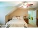 Comfortable bedroom with a bed, lamps, and a view into another room at 7371 Leasburg Rd, Roxboro, NC 27574