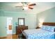 This bedroom features a wooden dresser, hardwood floors, and an ensuite bathroom at 7371 Leasburg Rd, Roxboro, NC 27574