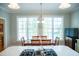 Bright breakfast nook with lots of natural light and wood table at 7371 Leasburg Rd, Roxboro, NC 27574