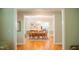 Elegant dining room with hardwood floors, chandelier, and view into the kitchen at 7371 Leasburg Rd, Roxboro, NC 27574