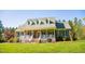 Stunning brick home with a covered front porch and well-maintained landscaping at 7371 Leasburg Rd, Roxboro, NC 27574