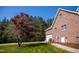 Spacious garage area with a beautifully landscaped walkway at 7371 Leasburg Rd, Roxboro, NC 27574