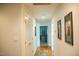 Hallway features hardwood floors, white doors, and art on the walls at 7371 Leasburg Rd, Roxboro, NC 27574