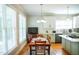 Charming eat-in kitchen with a dining table, bright white cabinets, and stainless steel appliances at 7371 Leasburg Rd, Roxboro, NC 27574