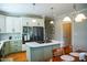 Bright kitchen with a spacious island and stainless steel appliances at 7371 Leasburg Rd, Roxboro, NC 27574