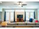 Spacious living room featuring hardwood floors, ceiling fan, recessed lighting, and access to the backyard at 7371 Leasburg Rd, Roxboro, NC 27574