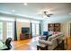 Open concept living room with hardwood floors, ceiling fan, and access to outdoor space at 7371 Leasburg Rd, Roxboro, NC 27574