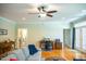 Cozy living room featuring hardwood floors, a comfortable seating area, and a dedicated workspace at 7371 Leasburg Rd, Roxboro, NC 27574