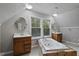 Bathroom features double sinks, soaking tub with tile surround and decorative ceiling at 952 Glover Rd, Dunn, NC 28334
