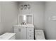 Modern bathroom vanity with stylish faucet, toilet, and ample lighting at 952 Glover Rd, Dunn, NC 28334