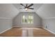 Spacious bedroom with wood floors, tin tile ceiling and lots of natural light at 952 Glover Rd, Dunn, NC 28334