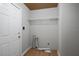 Functional laundry area with storage shelf, and door to the outside at 952 Glover Rd, Dunn, NC 28334