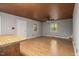Open-concept living room with hardwood floors, and wood ceiling at 952 Glover Rd, Dunn, NC 28334