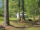 Rear view of a storage barn with a green lawn at 952 Glover Rd, Dunn, NC 28334