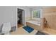 Bathroom features tub with tile surround and shower with tile surround at 5113 Windance Pl, Holly Springs, NC 27540