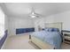 Bedroom with blue wainscoting, carpet, and fan at 5113 Windance Pl, Holly Springs, NC 27540