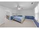 Bedroom with blue wainscoting, carpet, and fan at 5113 Windance Pl, Holly Springs, NC 27540