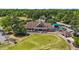 Aerial view of upscale clubhouse overlooking manicured golf course at 5113 Windance Pl, Holly Springs, NC 27540