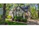 Beautiful home showcasing a side view, a well-maintained lawn, and an attached garage at 5113 Windance Pl, Holly Springs, NC 27540