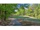 Lush green golf course and wooded areas in the background at 5113 Windance Pl, Holly Springs, NC 27540