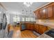 Beautiful kitchen with wooden cabinets, granite countertops, and stainless steel appliances at 5113 Windance Pl, Holly Springs, NC 27540