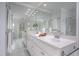 Bright bathroom featuring a large mirror, double sink vanity, and plenty of counter space at 10 Twinleaf Pl, Durham, NC 27705