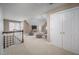 Large bonus room over the garage featuring neutral carpet, a seating area, and a TV at 10 Twinleaf Pl, Durham, NC 27705