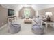 Cozy bonus room area featuring a sitting area, carpet floors, and natural light from the window at 10 Twinleaf Pl, Durham, NC 27705