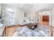 Cozy living room with a sofa, coffee table, and doorway to staircase at 10 Twinleaf Pl, Durham, NC 27705