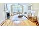 Bright living room featuring a fireplace, windows, sofa and coffee table at 10 Twinleaf Pl, Durham, NC 27705