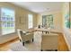 Bright office space featuring two armchairs, a white desk and large windows with natural light at 10 Twinleaf Pl, Durham, NC 27705