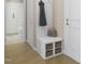 Hallway with a storage bench, coat hooks, and access to a bathroom at 1037 Zelkova Ln, Chapel Hill, NC 27517