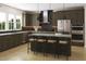Modern kitchen features stainless steel appliances, a large island with seating and beautiful wooden cabinets at 1037 Zelkova Ln, Chapel Hill, NC 27517