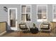 Inviting patio with comfortable seating and views into the home at 1037 Zelkova Ln, Chapel Hill, NC 27517