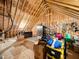 Spacious attic with exposed wooden beams and ample storage space at 104 Blue Finch Ct, Youngsville, NC 27596
