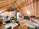 Unfinished attic with wooden rafters providing potential for storage at 104 Blue Finch Ct, Youngsville, NC 27596