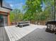 Outdoor back deck with dining area overlooking serene wooded views. A great outdoor living space at 104 Blue Finch Ct, Youngsville, NC 27596