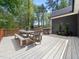 Spacious outdoor deck, perfect for al fresco dining and entertaining with wooded views at 104 Blue Finch Ct, Youngsville, NC 27596