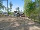 Backyard with fence surrounding the home and trees providing a great view at 104 Blue Finch Ct, Youngsville, NC 27596