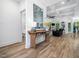 Entryway with hardwood flooring, leading to the Gathering room and a half bathroom at 104 Blue Finch Ct, Youngsville, NC 27596