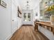 Bright entryway with hardwood floors, console table, and a clear view of the front door at 104 Blue Finch Ct, Youngsville, NC 27596